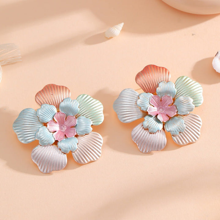 Ladies' flower earrings with intricate design and glossy accents Land Girl