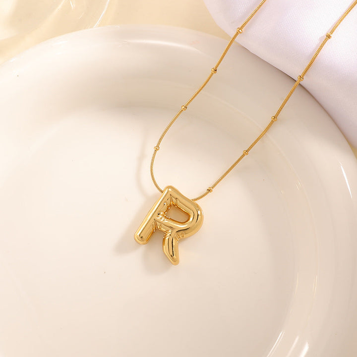 Women's necklace with curved letter pendant Land Girl