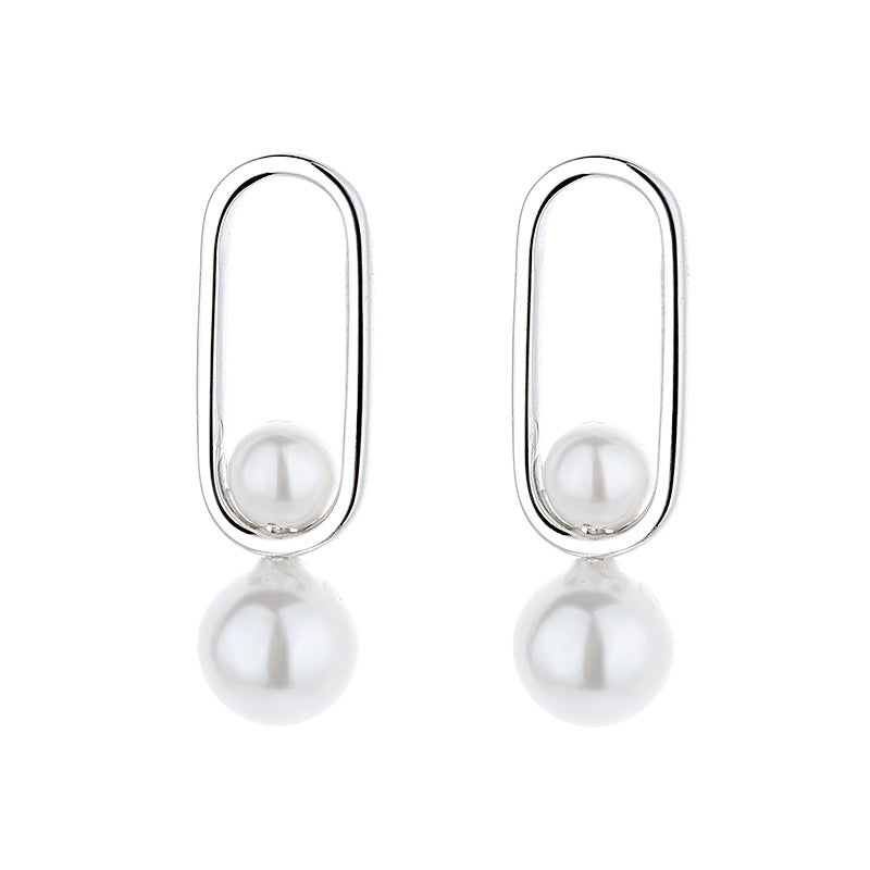 Women's stud earrings with modern oval design and elegant pearls Land Girl