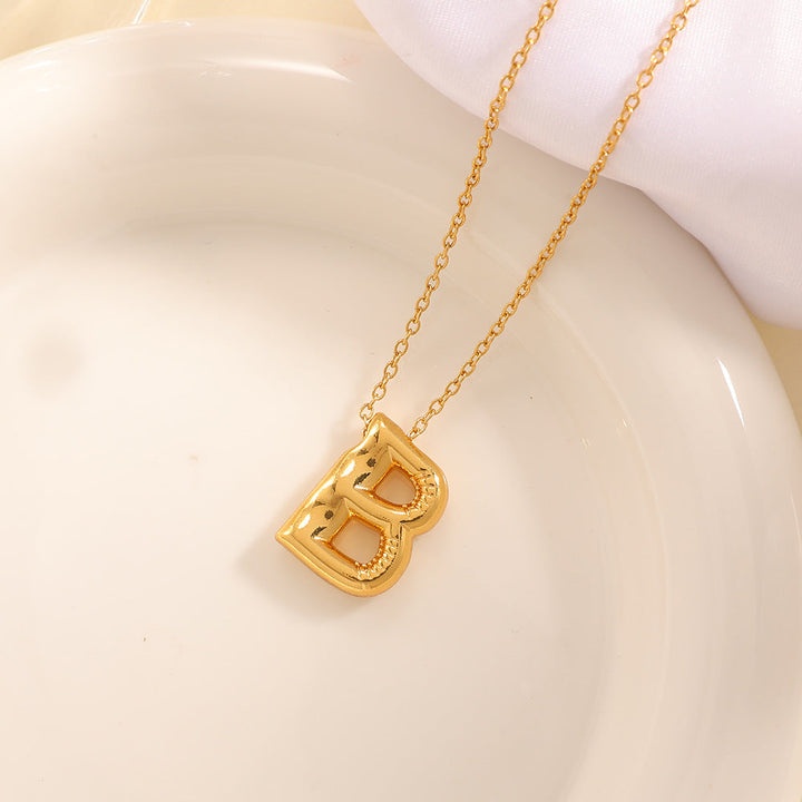 Women's necklace with curved letter pendant Land Girl