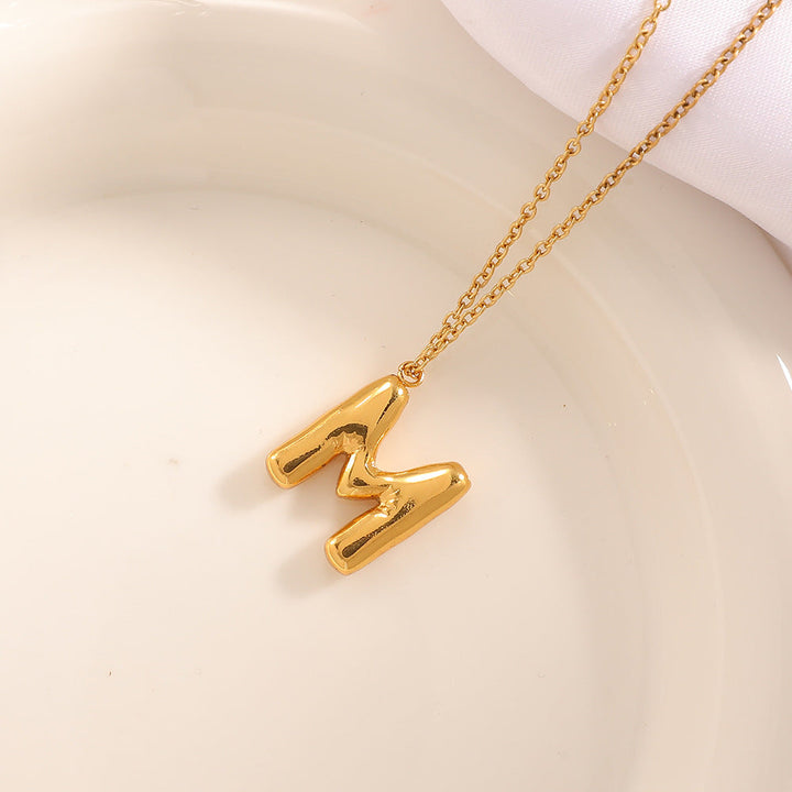 Women's necklace with curved letter pendant Land Girl