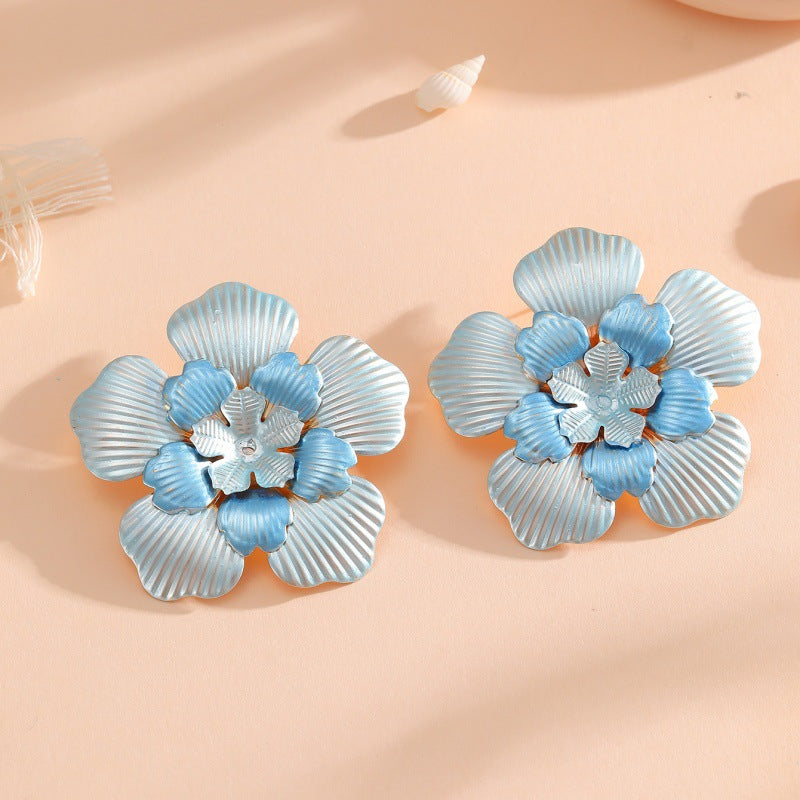 Ladies' flower earrings with intricate design and glossy accents Land Girl