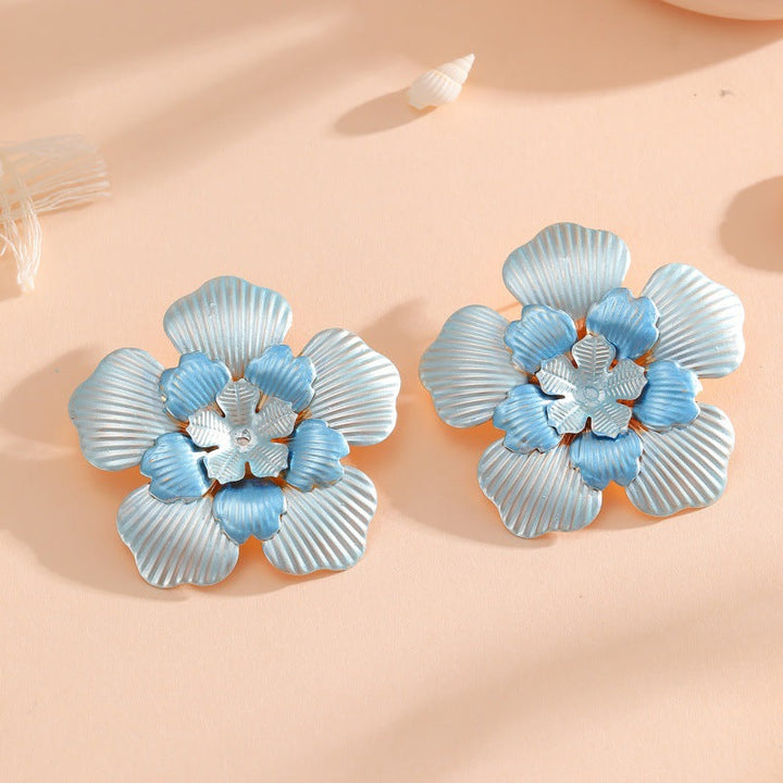 Ladies' flower earrings with intricate design and glossy accents Land Girl