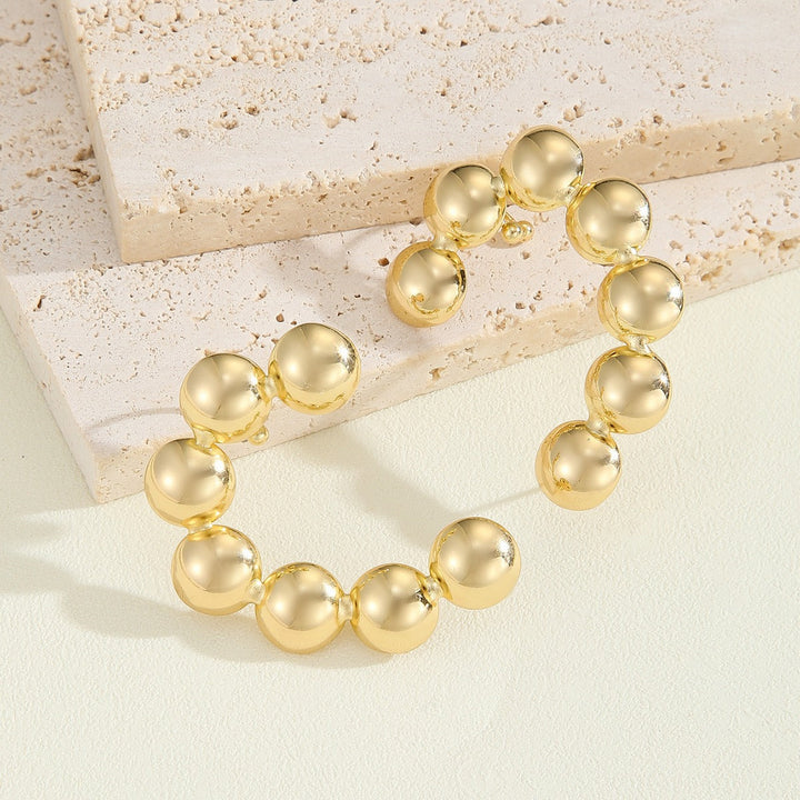 Women's bracelet with structured, golden beads Land Girl