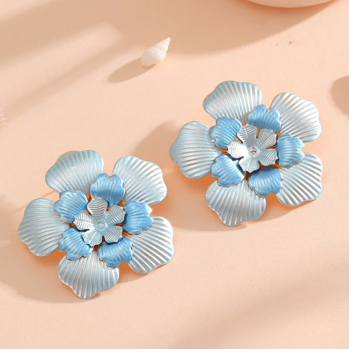 Ladies' flower earrings with intricate design and glossy accents Land Girl
