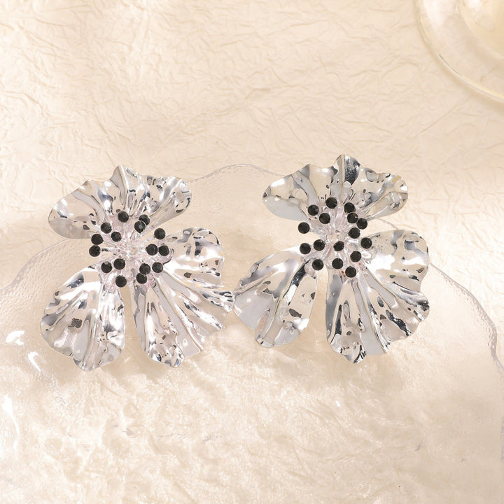 Women’s metal flower earrings with sparkling red accents Land Girl