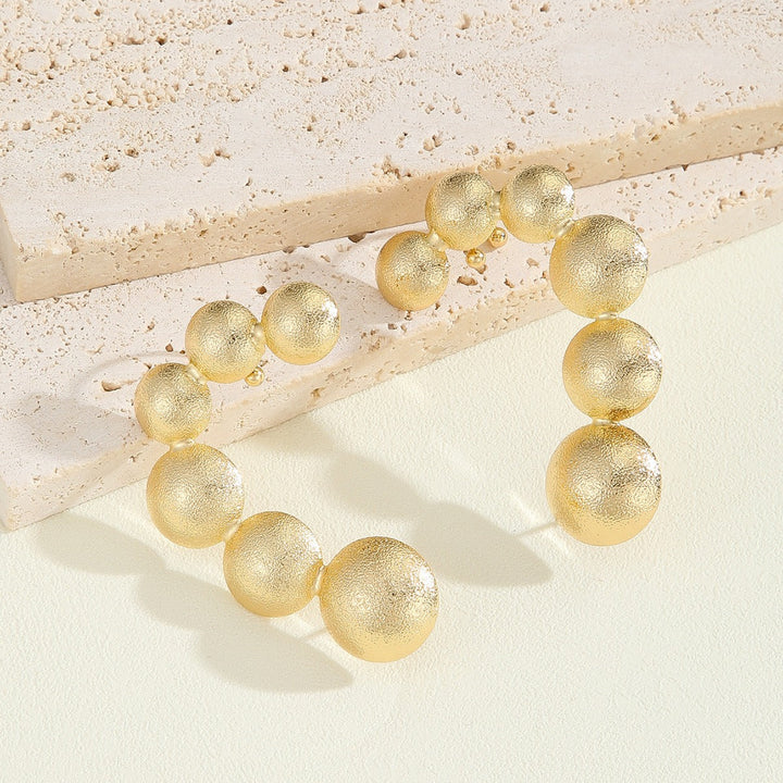 Women's bracelet with structured, golden beads Land Girl