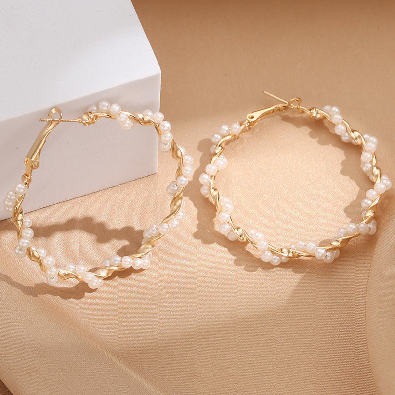 Ladies hoop earrings with luxurious pearl accents and elegant, twisted design Land Girl