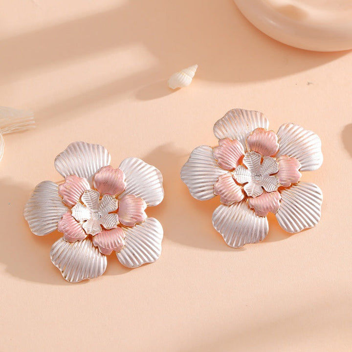 Ladies' flower earrings with intricate design and glossy accents Land Girl