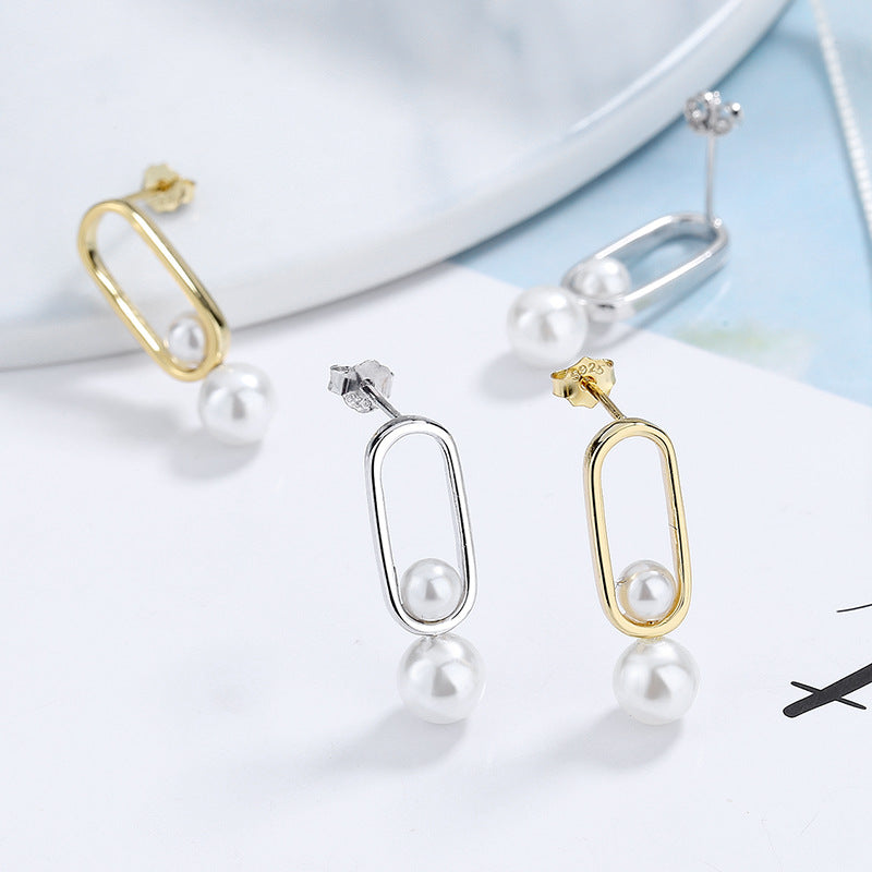 Women's stud earrings with modern oval design and elegant pearls Land Girl