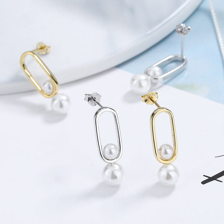 Women's stud earrings with modern oval design and elegant pearls Land Girl