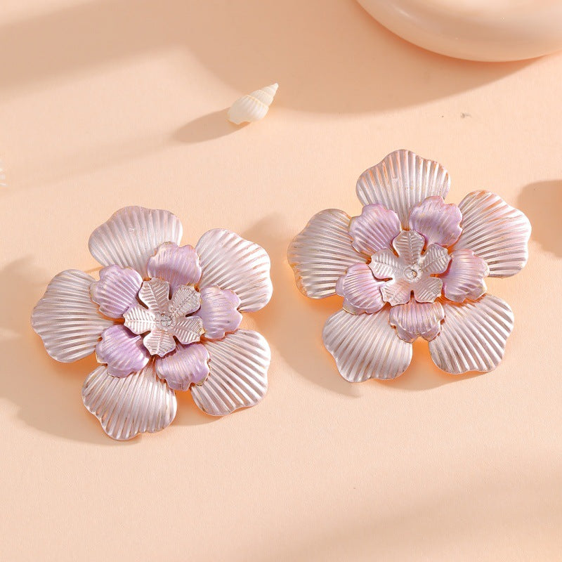 Ladies' flower earrings with intricate design and glossy accents Land Girl