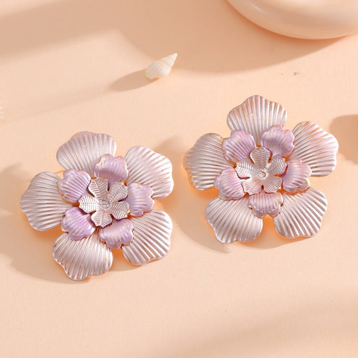 Ladies' flower earrings with intricate design and glossy accents Land Girl